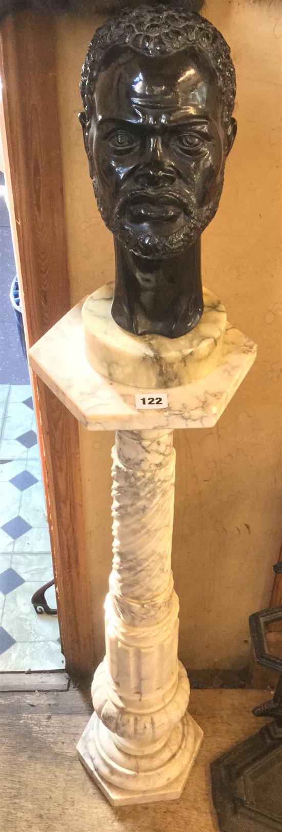 Victorian variegated marble column, together with a carved negro head